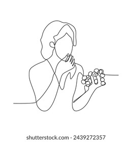 One continuous line drawing of a woman is holding fruit and is about to eat it vector design illustration. Women eating fruit activity illustration in simple linear style vector design concept.