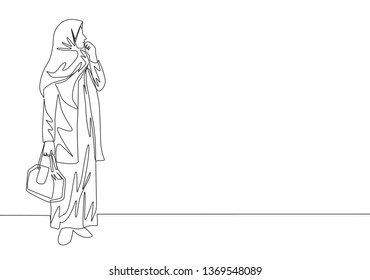 One continuous line drawing of young happy attractive muslimah with veil holding pocket bag. Beautiful Asian woman model in trendy hijab fashion concept single line draw design vector illustration