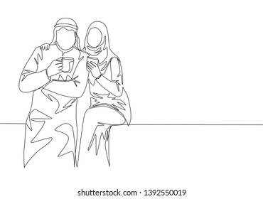 One continuous line drawing of young muslim and muslimah couple pose romantic together while holding a cup of coffee. Islamic clothing shmagh, kandura, scarf. Single line draw design illustration