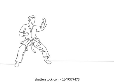 One continuous line drawing of young talented karateka man train pose for duel fighting at dojo gym center. Mastering martial art sport concept. Dynamic single line draw design vector illustration