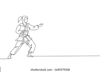 One continuous line drawing of young talented karateka girl train pose for duel fighting at dojo gym center. Mastering martial art sport concept. Dynamic single line draw design vector illustration