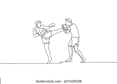 One continuous line drawing of young sporty man kickboxer athlete training with personal trainer who hold punch bag at gym center. Combative sport concept. Single line draw design vector illustration