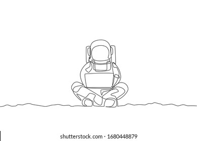 One continuous line drawing of young spaceman on spacesuit sitting in moon surface while typing. Astronaut business office with deep space concept. Dynamic single line draw design vector illustration