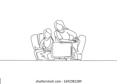 One continuous line drawing of young mother and daughter sitting on sofa while playing video game together at home. Happy family parenthood concept. Dynamic single line draw design vector illustration