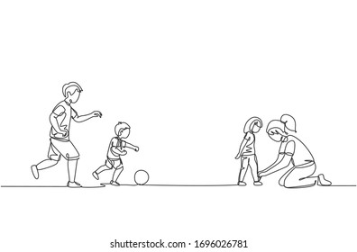 One continuous line drawing young playing soccer and son at field while mother tying daughter's shoelaces  Happy family parenting concept  Dynamic single line draw design vector illustration