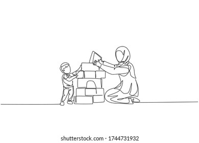 One continuous line drawing of young Arabian mother playing block foam puzzle brick with son. Happy Islamic muslim loving parenting family concept. Dynamic single line draw design vector illustration