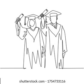 One continuous line drawing of young happy couple college student proud to show their graduation letter to celebrate their graduate. Education concept single line draw design vector illustration