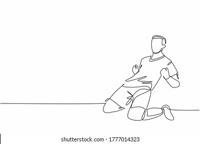 One continuous line drawing of young sporty soccer player sliding on the field emotionally after scoring a goal. Match goal scoring celebration concept single line draw design vector illustration