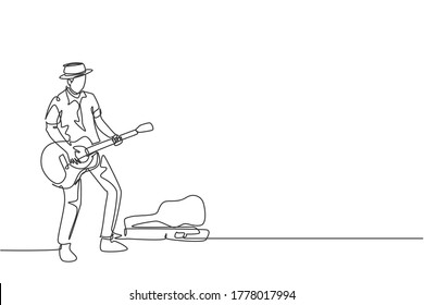 One continuous line drawing of young happy male guitarist standing and busking by playing guitar on city road. Street musician artist performance concept single line draw design vector illustration