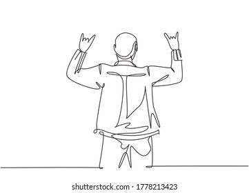 One continuous line drawing of young happy male rocker singer giving hand gesture of rock music on concert stage. Trendy musician artist performance concept single line draw design vector illustration