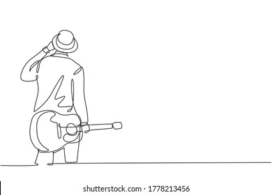 Eine kontinuierliche Zeichnung eines jungen, glücklichen Gitarristen, der Hut trägt und akustische Gitarre auf der Hand hält. Modernes Künstlerkonzept für Musiker mit nur einer Linie, grafisches Design, Vektorgrafik