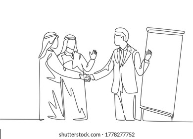 One continuous line drawing of young muslim business man handshake his partner after meeting presentation. Saudi Arabian with shemag, kandura and scarf. Single line draw design vector illustration