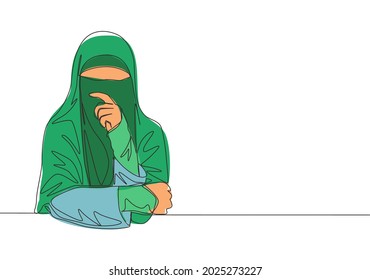 One continuous line drawing of young pretty Asian muslimah wearing burqa while touching her lips. Traditional beautiful Islamic woman niqab dress concept single line draw design vector illustration