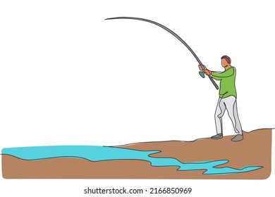 One continuous line drawing of young happy fisherman standing and fishing a fish at the riverside. Fishing leisure hobby vacation concept. Dynamic single line draw design vector graphic illustration