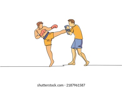 One continuous line drawing of young sporty man kickboxer athlete training with personal trainer who hold punch bag at gym center. Combative sport concept. Single line draw design vector illustration