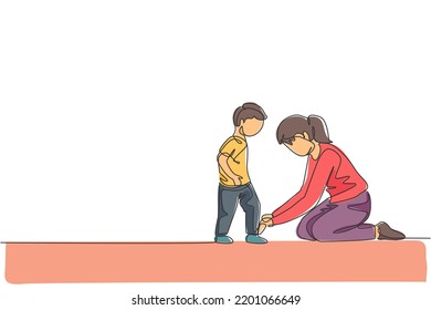 One continuous line drawing young happy mom at home tying her son shoelaces before going to school in the morning. Family parenting concept. Dynamic single line draw design vector illustration graphic