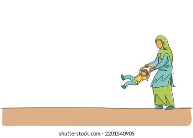 One continuous line drawing of young Islamic mom playing and lift her daughter girl at home. Happy Arabian muslim loving parenting family concept. Dynamic single line draw design vector illustration