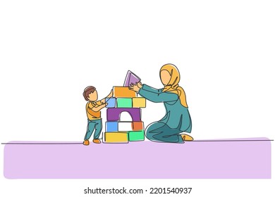 One continuous line drawing of young Arabian mother playing block foam puzzle brick with son. Happy Islamic muslim loving parenting family concept. Dynamic single line draw design vector illustration