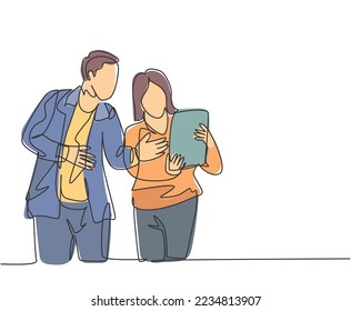 One continuous line drawing of young startup members check the work each others using laptop and tablet. Business process teamwork concept. Single line draw design vector illustration