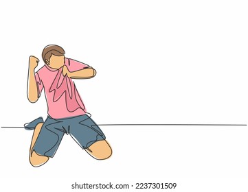 One continuous line drawing of young soccer player kissing the badge on his jersey and raises fist hand to the sky. Match goal scoring celebration concept single line draw design vector illustration