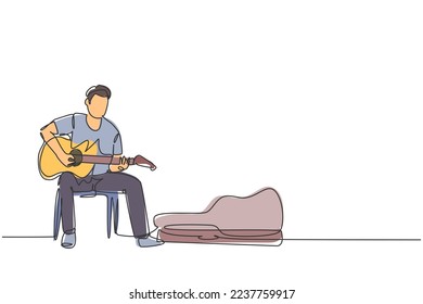 One continuous line drawing of young happy male guitarist sitting and busking by playing guitar on uptown road. Street musician artist performance concept single line draw design vector illustration