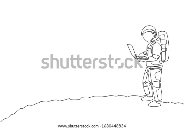 One continuous line drawing of young\
spaceman on spacesuit standing while typing in moon surface.\
Astronaut business office with deep space concept. Dynamic single\
line draw design vector\
illustration