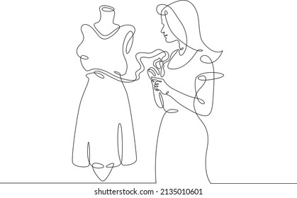 One continuous line.A fashion designer designs a dress. A seamstress works with a mannequin.Fashion designer, dressmaker, seamstress, sewing workshop or courses, tailoring concept. Continuous line