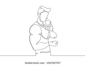 One continuous single drawn line art doodle athlete bodybuilder fitness relieves himself on  phone .Guy athlete makes selfie . Isolated image  hand drawn outline  white background.Gym, sports concept.