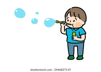 Un chico lindo soplando burbujas.
