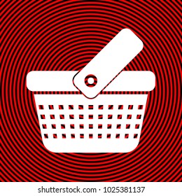 One grip shopping basket with four rows of holes. Vector. White icon on red and black radial pattern as background. Isolated.