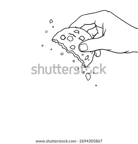 one hand holding half a cut cookie