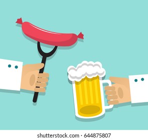 One hand holds a mug of beer with foam, the second hand holds a sausage on the fork