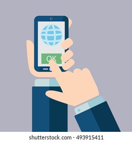 One hand holds smartphone and finger touch screen. 