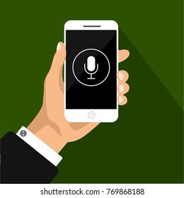  One hand holds smartphone with microphone on black screen. Voice message. Vector flat illustration. Mockup phone.