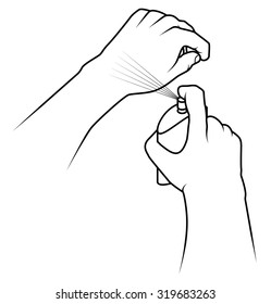 One hand spraying perfume