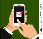 One incoming message or letter on the phone screen. One hand holds smartphone and finger touch screen. Mockup phone.
