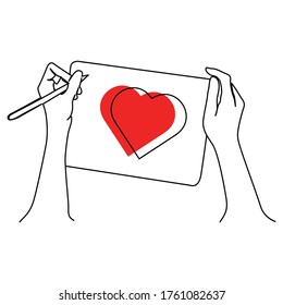 one line continuous drawing left hand drawing love symbol on a piece of paper