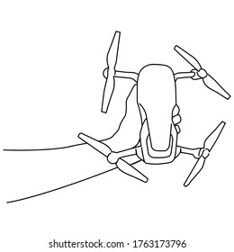una línea de dibujo continuo mano izquierda sosteniendo el dron quadcopter
