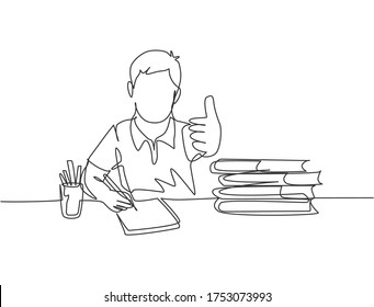 One line drawing of young happy boy student study diligently beside the stack of books and giving thumbs up gesture. Education concept continuous line graphic draw design vector illustration