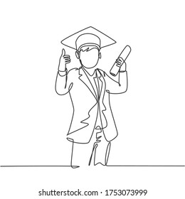 One line drawing of young happy boy student wearing graduation hat and giving thumbs up gesture while holding graduation paper roll. Education concept continuous line draw design vector illustration