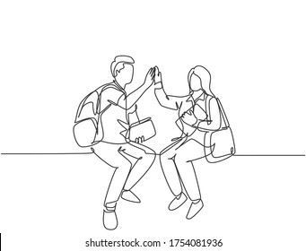 One line drawing of young happy couple man and woman student sitting at chair after the class and giving high five gesture. Relationship concept continuous line draw design vector graphic illustration