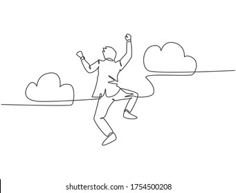 One line drawing of young happy and energetic business man punching a fist into the air and jumping over the cloud. Business success celebration concept continuous line draw design vector illustration