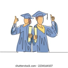 One line drawing of young happy couple male and female student wearing graduation uniform and holding the diploma certificate paper. Education concept continuous line draw design vector illustration