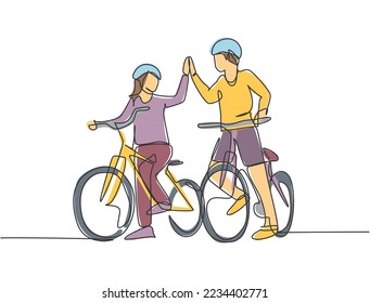 One line drawing of young happy couple male and female take a walk with bicycle together and giving high five gesture. Romantic relationship concept. Continuous line draw design vector illustration