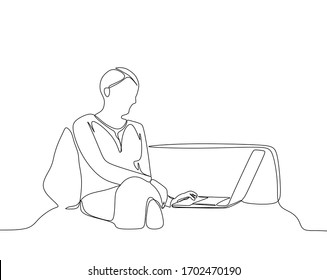 One line drawn vector of a women is working on laptop at the sofa