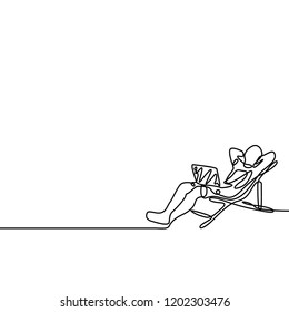 One line freelancer working with a laptop lying on a lounger