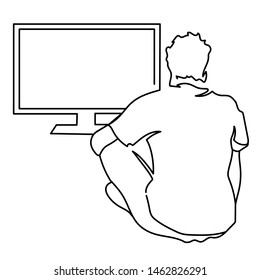 One Line Man Is Sitting At Computer Or TV Or Console View From The Back 