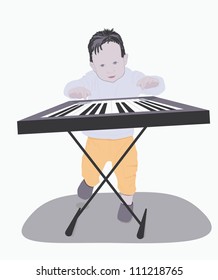 one little boy plays a synthesizer