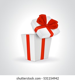 One open white gift box with red ribbon and bow.