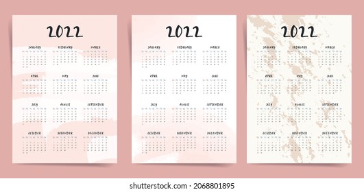 One page wall fashion elegant calendar 2022 set. 2022 new year calendar with watercolor abstract background in pink and beige colors. Aesthetic A3 A4 calendar template. 